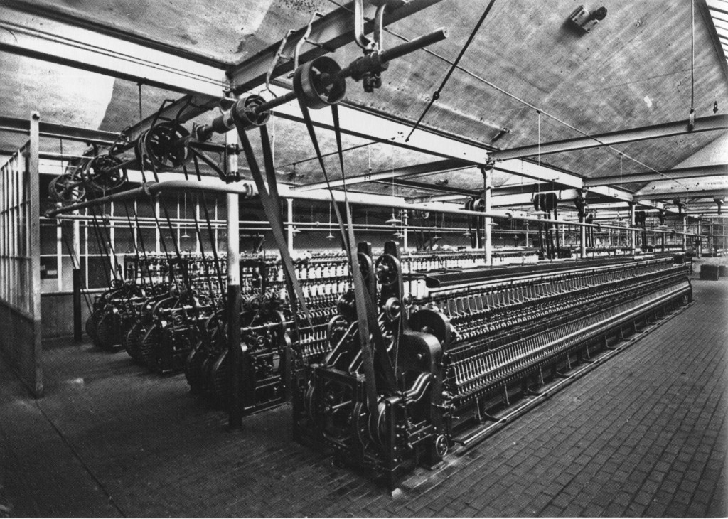 Four wool spinning machines driven by belts from an overhead lineshaft (Leipzig, Germany, circa 1925)